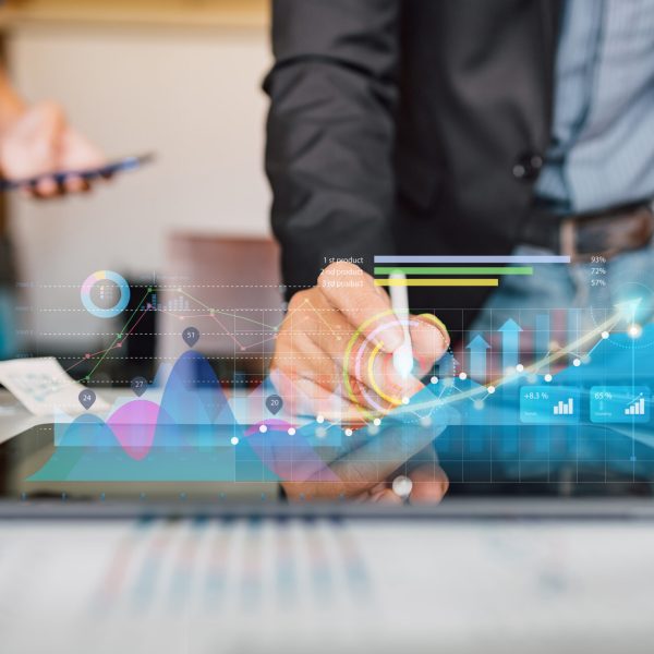 businessman-analyzing-company-financial-report-with-augmented-reality-graphic